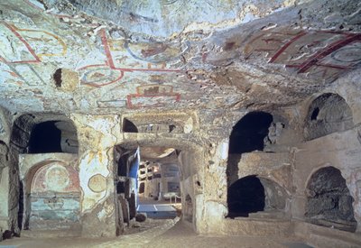 Interior of a catacomb chamber cut from tufa stone showing fragments of frescoed decoration, 2nd century by Paleo Christian